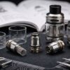 Various GeekVape coils and compatible tanks on technical workspace